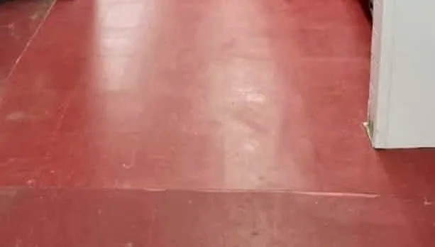Patton’s work in a restaurant kitchen: the new glossy red floor.